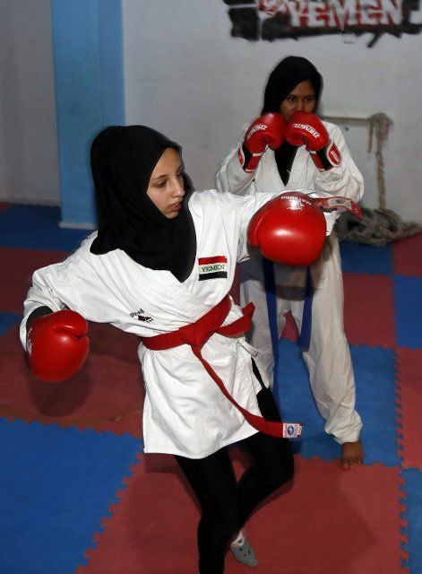 (211218) -- SANAA, Dec. 18, 2021 (Xinhua) -- A Yemeni girl learns kickboxing inside a gym in Sanaa, Yemen, Dec. 12, 2021. TO GO WITH "Feature: Yemeni female athlete promotes kickboxing, martial arts among girls in Sanaa" (Photo by Mohammed Mohammed\/Xinhua