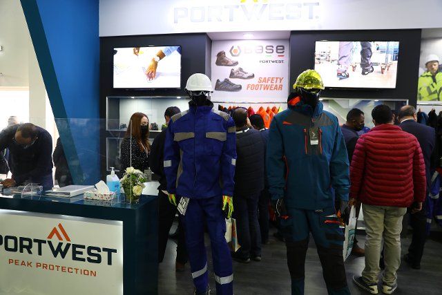 (220215) -- CAIRO, Feb. 15, 2022 (Xinhua) -- People visit the booth of workwear company Portwest at the 5th Egypt Petroleum Show in Cairo, Egypt, on Feb. 15, 2022. More than 450 exhibitors from over 20 countries are attending the 5th Egypt Petroleum Show held in the Egyptian capital of Cairo, to seek business and identify solutions to reshape the global energy market. (Xinhua\/Ahmed Gomaa