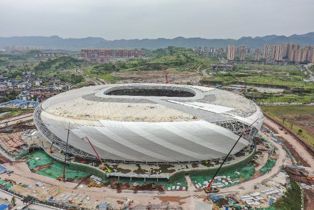 (220329) -- CHONGQING, March 29, 2022 (Xinhua) -- Aerial photo taken on March 29, 2022 shows the construction site of Chongqing Longxing football stadium in southwest China\