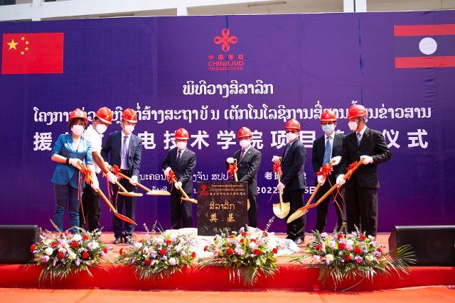(220426) -- VIENTIANE, April 26, 2022 (Xinhua) -- Photo taken on April 25, 2022 shows the groundbreaking ceremony of a China-aided educational facility project in Vientiane, capital of Laos. TO GO WITH "Construction of China-aided educational facility starts in Lao capital". (Photo by Kaikeo Saiyasane\/Xinhua