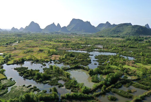 (220408) -- GUILIN, April 8, 2022 (Xinhua) -- Aerial photo taken on April 7, 2022 shows the scenery of the Huixian Wetlands in Guilin, south China\