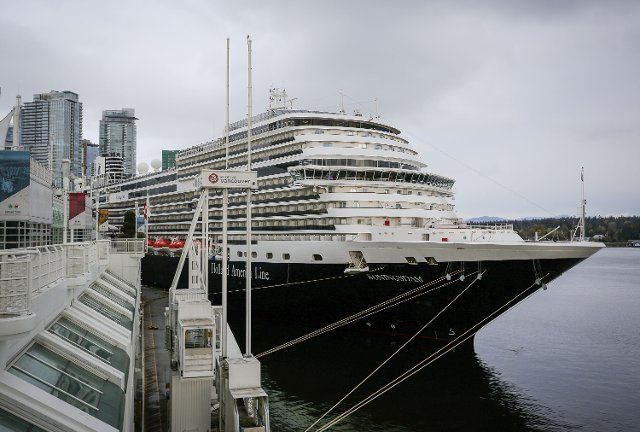 (220410) -- VANCOUVER, April 10, 2022 (Xinhua) -- The Holland America Koningsdam cruise ship is berthed at the Canada Place cruise terminal in Vancouver, British Columbia, Canada, on April 10, 2022. The Holland America Koningsdam on Sunday became the first cruise ship to call at the port of Vancouver in about two and half years since the onset of the coronavirus pandemic. About 310 cruise ship calls are expected for the 2022 season, according to Vancouver Fraser Port Authority. (Photo by Liang Sen\/Xinhua