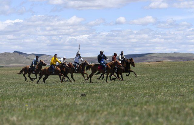 (220605) -- FENGNING, June 5, 2022 (Xinhua) -- Tourists ride horses on the grasslands in Bashang area of Fengning Manchu Autonomous County, north China\