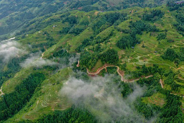 (220623) -- RONGJIANG, June 23, 2022 (Xinhua) -- Aerial photo taken on June 23, 2022 shows the scenery of terraced fields in Jiayi Village of Rongjiang County, southwest China\