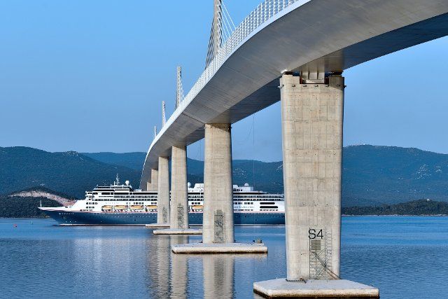 (220624) -- KOMARNA, June 24, 2022 (Xinhua) -- A cruiser named Bolette passes under the Peljesac Bridge near Komarna, Croatia, June 23, 2022. (Matko Begovic\/PIXSELL via Xinhua