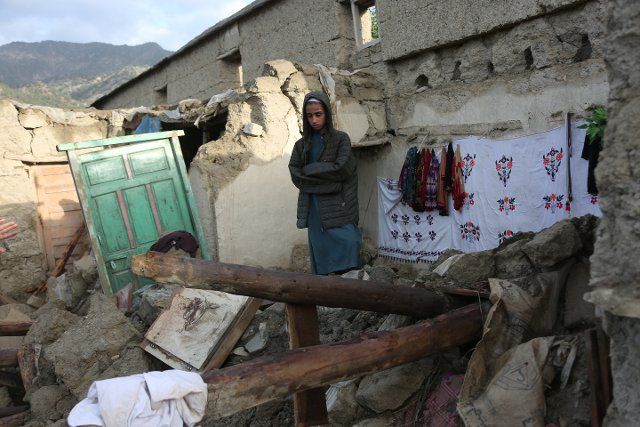 (220624) -- PAKTIKA, June 24, 2022 (Xinhua) -- A man stands on the rubble of a house damaged in an earthquake in Paktika province, Afghanistan, June 23, 2022. In the 5.9-magnitude earthquake that jolted parts of Afghanistan including the capital city Kabul early Wednesday, more than 1,000 people including women and children have been confirmed dead and over 1,500 others injured in Paktika and the neighboring Khost provinces. (Photo by Saifurahman Safi\/Xinhua