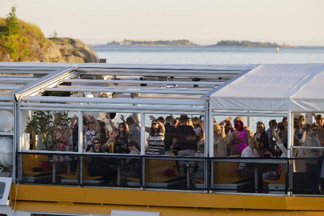 (220625) -- HELSINKI, June 25, 2022 (Xinhua) -- People celebrate Midsummer on a boat in Helsinki, Finland, June 24, 2022. Midsummer Festival is an important festival and also one of the national holidays in Finland. (Photo by Matti Matikainen\/Xinhua