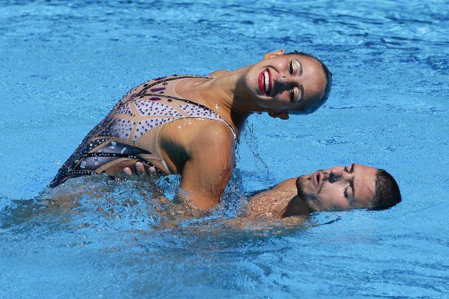 (220625) -- BUDAPEST, June 25, 2022 (Xinhua) -- Giorgio Minisini (R) and Lucrezia Ruggiero of Italy perform during the Mixed Duet Free Final of Artistic Swimming at the 19th FINA World Championships in Budapest, Hungary, June 25, 2022. (Xinhua\/Zheng Huansong