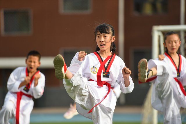(220625) -- BAOTOU, June 25, 2022 (Xinhua) -- Students learn taekwondo during an after-class activity in a primary school in Baotou, north China\