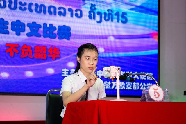 (220625) -- VIENTIANE, June 25, 2022 (Xinhua) -- Sengsavanh Chuangpaseuth, the champion of the 15th "Chinese Bridge" contest for non-Chinese secondary school students, answers questions online in Vientiane, Laos, June 24, 2022. Laos held the final round of the 15th "Chinese Bridge" contest for non-Chinese secondary students in the capital Vientiane on Friday, and released the final result on Saturday. (Photo by Kaikeo Saiyasane\/Xinhua