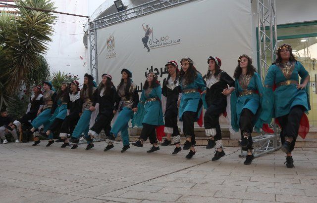 (220625) -- NABLUS, June 25, 2022 (Xinhua) -- People perform the traditional dance Dabke during the Palestinian Popular Dabke Festival in the West Bank city of Nablus, on June 25, 2022. (Photo by Nidal Eshtayeh\/Xinhua