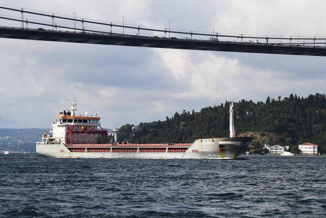 (220808) -- ISTANBUL, Aug. 8, 2022 (Xinhua) -- A vessel in the second caravan of ships transporting grain from Ukraine passes through the Bosphorus Strait in Istanbul, T¨¹rkiye, Aug. 7, 2022. Efforts to bring Ukrainian grain to international markets via the Black Sea have gone into a higher gear as the inspections of the second caravan of ships off Istanbul were concluded on Sunday. (Xinhua\/Shadati