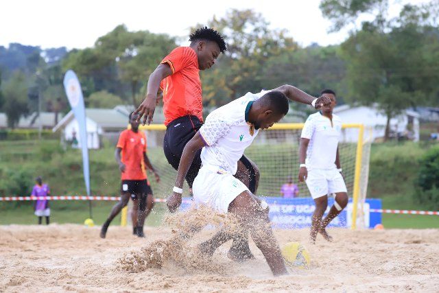 (220808) -- BUIKWE, Aug. 8, 2022 (Xinhua) -- Players of both sides compete during the Beach Soccer AFCON qualifiers 2022 second leg match between Uganda and Comoros at FUFA Technical Center at Njeru in Buikwe District, Uganda, on August 7, 2022. (Photo by Hajarah Nalwadda\/Xinhua