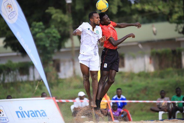 (220808) -- BUIKWE, Aug. 8, 2022 (Xinhua) -- Players of both sides head the ball during the Beach Soccer AFCON qualifiers 2022 second leg match between Uganda and Comoros at FUFA Technical Center at Njeru in Buikwe District, Uganda, on August 7, 2022. (Photo by Hajarah Nalwadda\/Xinhua