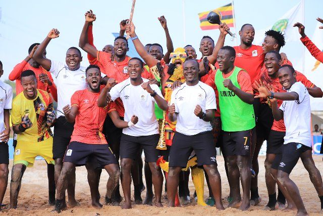 (220808) -- BUIKWE, Aug. 8, 2022 (Xinhua) -- Uganda Sand Cranes celebrate with fans after winning the Beach Soccer AFCON qualifiers 2022 second leg match between Uganda and Comoros at FUFA Technical Center at Njeru in Buikwe District, Uganda, on August 7, 2022. (Photo by Hajarah Nalwadda\/Xinhua