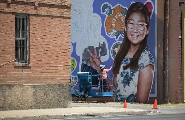(220810) -- UVALDE, Aug. 10, 2022 (Xinhua) -- An artist paints a mural of Tess Mata, one of the schoolchildren killed in the mass shooting at Robb Elementary School in Uvalde, Texas, the United States on Aug. 8, 2022. TO GO WITH "Feature: Worries over safety linger as new school year starts after Uvalde shooting" (Photo by Nick Wagner\/Xinhua