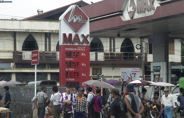 (220810) -- YANGON, Aug. 10, 2022 (Xinhua) -- A billboard indicating fuel prices is seen in front of a petrol station in Yangon, Myanmar, Aug. 10, 2022. Myanmar\