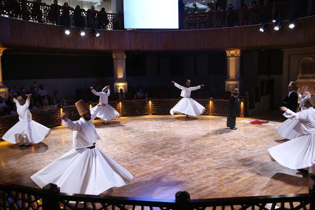 (220810) -- KONYA (T?RKIYE), Aug. 10, 2022 (Xinhua) -- People perform the Sufi whirling dance in Konya, T¨¹rkiye, on Aug. 10, 2022. (Xinhua\/Li Zhenbei