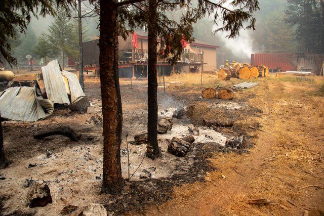 (220910) -- LAKE TAHOE, Sept. 10, 2022 (Xinhua) -- Photo taken on Sept. 9, 2022 shows a scene after a fire in the forests near Lake Tahoe in north California, the United States. Multiple forest fires took place recently due to hot and dry weather in California. (Photo by Dong Xudong\/Xinhua