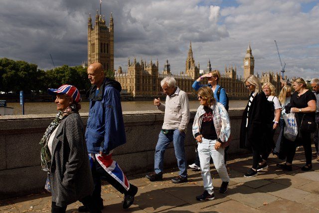 (220916) -- LONDON, Sept. 16, 2022 (Xinhua) -- People wait in line to pay tributes to the late Queen Elizabeth II in London, Britain, Sept. 15, 2022. The Queen will lie in state in Westminster Hall for several days before her funeral on Sept. 19. (Photo by Tim Ireland\/Xinhua