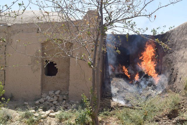 (220811) -- JAWZJAN, Aug. 11, 2022 (Xinhua) -- Photo taken on Aug. 10, 2022 shows a natural fire in a residential area in Jawzjan province, Afghanistan. At least 50 residential houses have been burned to ashes by natural fire in the northern province of Jawzjan since Monday, provincial police chief Damullah Serajuddin Ahmadi said Wednesday. (Photo by Zekrullah Yazdani\/Xinhua