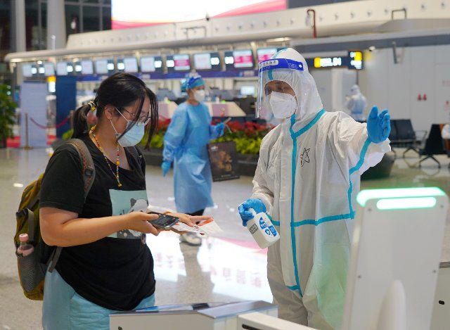 (220812) -- HAIKOU, Aug. 12, 2022 (Xinhua) -- A passenger is about to get security check at Haikou Meilan International Airport in Haikou, south China\