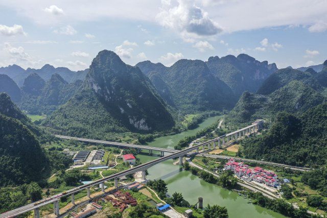 (220816) -- HECHI, Aug. 16, 2022 (Xinhua) -- Aerial photo taken on Aug. 16, 2022 shows the Longjiang River grand bridge of the Guiyang-Nanning high-speed railway (Guangxi section) in Hechi, south China\