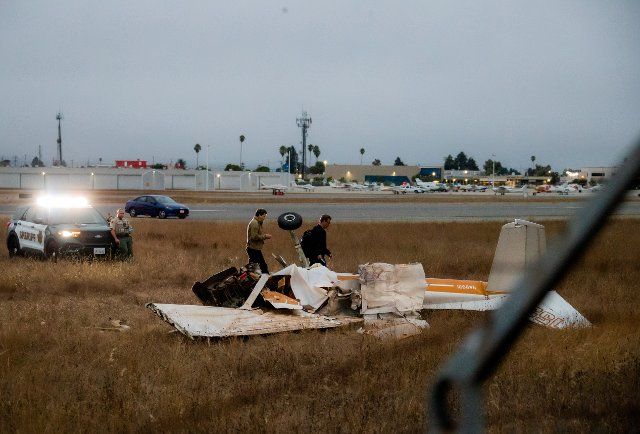 (220819) -- WATSONVILLE, Aug. 19, 2022 (Xinhua) -- Investigators work at the site of the plane crash in Watsonville Municipal Airport of Watsonville, California, the United States, Aug. 18, 2022. Multiple people have been reportedly killed after two planes collided while attempting to land in Watsonville, California, the United States, authorities tweeted Thursday afternoon. The crash happened around 2:56 p.m. (2156 GMT) at the Watsonville Municipal Airport and multiple agencies rushed to the scene at around 3:37 p.m. (2237 GMT), according to the city\