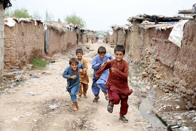 (220819) -- ISLAMABAD, Aug. 19, 2022 (Xinhua) -- Afghan refugee children play at a slum in Islamabad, capital of Pakistan, Aug. 18, 2022. The World Humanitarian Day was marked on Aug. 19. (Xinhua\/Ahmad Kamal