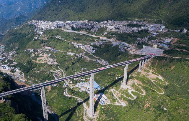 (220826) -- CHENGDU, Aug. 26, 2022 (Xinhua) -- Aerial photo taken on June 30, 2022 shows a view of a mega bridge above the Jinyang River, which connects the old and new districts of Jinyang County, in southwest China\