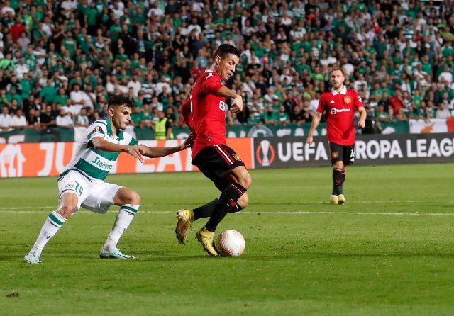 (221007) -- NICOSIA, Oct. 7, 2022 (Xinhua) -- Cristiano Ronaldo (C) of Manchester United vies with Charalampos Charalampous (L) of Omonoia Nicosia during an UEFA Europa League match between Omonia Nicosia and Manchester United at GSP Stadium in Nicosia, Cyprus, on Oct. 6, 2022. (Photo by George Christophorou\/Xinhua
