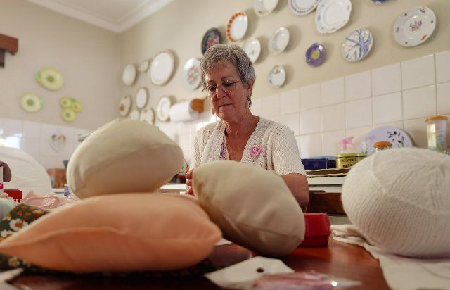 (221019) -- WINDHOEK, Oct. 19, 2022 (Xinhua) -- Hester Koch, founder of Breast Buddies Project, displays handmade breast prostheses in Windhoek, Namibia, on Oct. 19, 2022. TO GO WITH "Namibian breast cancer survivor boosts confidence to women with breast problems" (Photo by Ndalimpinga Iita\/Xinhua