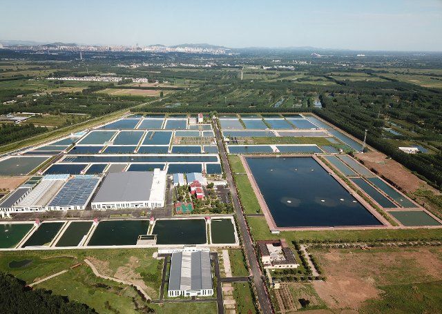 (220925) -- JINAN, Sept. 25, 2022 (Xinhua) -- Aerial photo taken on Aug. 23, 2022 shows a fishery industrial park in Weishan County, east China\
