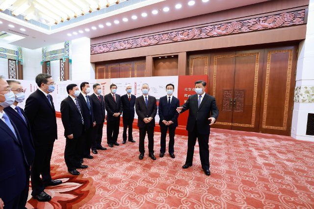 (220930) -- BEIJING, Sept. 30, 2022 (Xinhua) -- Chinese President Xi Jinping, also general secretary of the Communist Party of China (CPC) Central Committee and chairman of the Central Military Commission, views an exhibition on the C919 project\