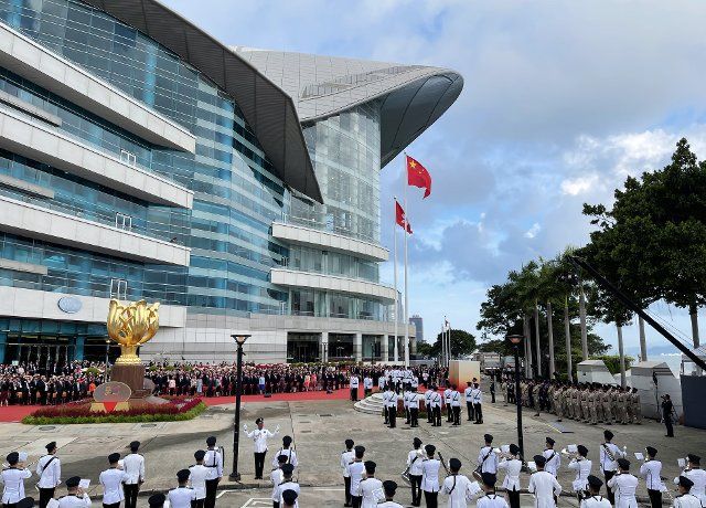 (221001) -- HONG KONG, Oct. 1, 2022 (Xinhua) -- A flag-raising ceremony is held at the Golden Bauhinia Square by the Hong Kong Special Administrative Region (HKSAR) government to celebrate the 73rd anniversary of the founding of the People\