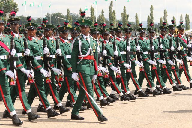 (221001) -- ABUJA, Oct. 1, 2022 (Xinhua) -- Photo taken on Oct. 1, 2022 shows soldiers participating in a parade marking Nigeria\