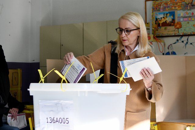 (221002) -- SARAJEVO, Oct. 2, 2022 (Xinhua) -- A voter casts her ballot at a polling station in Sarajevo, Bosnia and Herzegovina (BiH), on Oct. 2, 2022. Almost 3.4 million registered voters in Bosnia and Herzegovina (BiH) will cast votes on Sunday and elect among 518 candidates running for the Presidency of BiH, and the Parliamentary Assembly of BiH. (Photo by Nedim Grabovica\/Xinhua
