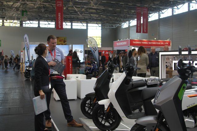 (221004) -- COLOGNE (GERMANY), Oct. 4, 2022 (Xinhua) -- People visit the International Motorcycle, Scooter and E-bike Fair in Cologne, Germany, on Oct. 4, 2022. INTERMOT, the International Motorcycle, Scooter and E-bike Fair, opened its doors here on Tuesday after a lengthy, four-year break. Between Oct. 4 and Oct. 9, some 500 companies and brands from 29 countries and regions will showcase their new models and product innovations and tap into new target groups. (Xinhua\/Shan Weiyi