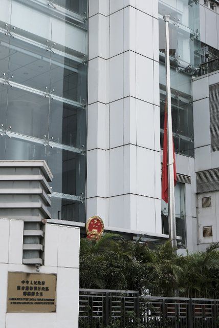 (221201) -- HONG KONG, Dec. 1, 2022 (Xinhua) -- A Chinese national flag is flown at half-mast to mourn the death of Comrade Jiang Zemin at the Liaison Office of the Central People\