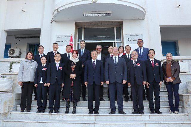 (221205) -- TUNIS, Dec. 5, 2022 (Xinhua) -- Tunisian Health Minister Ali Mrabet (4th R, front row) poses for a group photo with members of Chinese medical team in Tunis, Tunisia, on Dec. 5, 2022. Mrabet met with the 26th batch of the Chinese medical team in Tunisia on Monday, applauding its exceptional service in the North African country. (Xinhua
