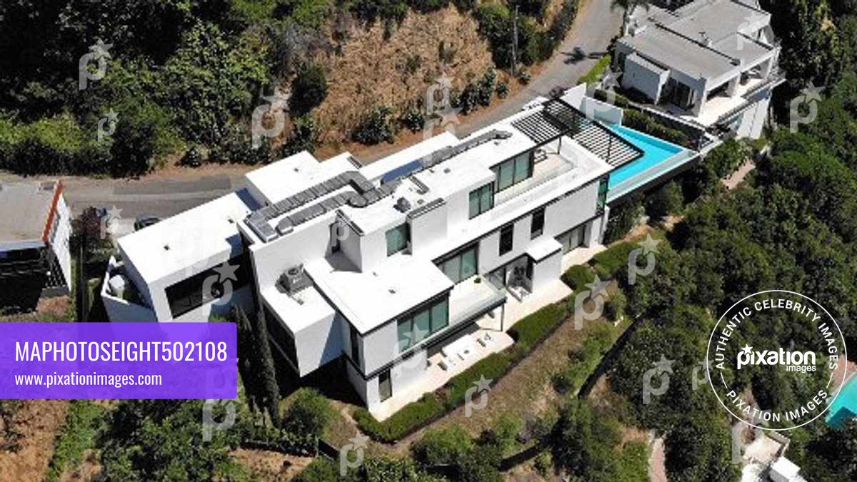 Ariana Grande purchases this $13.7 million Mega Mansion in the Hollywood Hills, The 10,000 square foot home has 4 bedrooms, 7 bathrooms, a wellness, 300 bottle wine cellar, a bar and a office