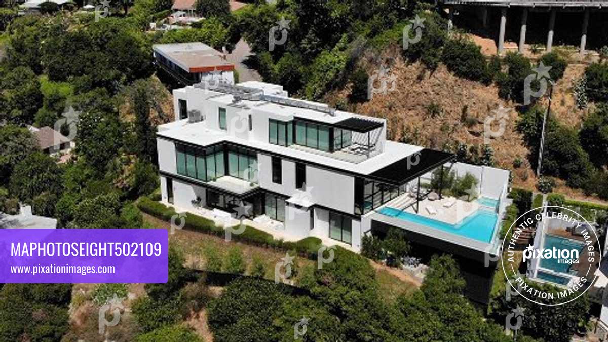 Ariana Grande purchases this $13.7 million Mega Mansion in the Hollywood Hills, The 10,000 square foot home has 4 bedrooms, 7 bathrooms, a wellness, 300 bottle wine cellar, a bar and a office