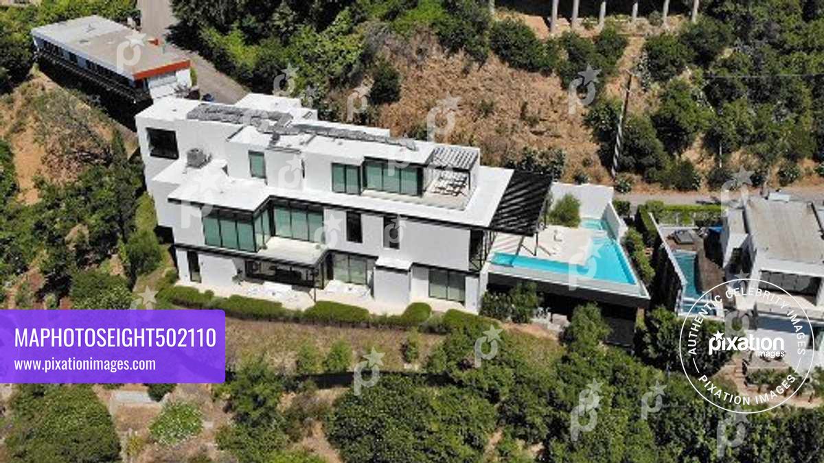 Ariana Grande purchases this $13.7 million Mega Mansion in the Hollywood Hills, The 10,000 square foot home has 4 bedrooms, 7 bathrooms, a wellness, 300 bottle wine cellar, a bar and a office