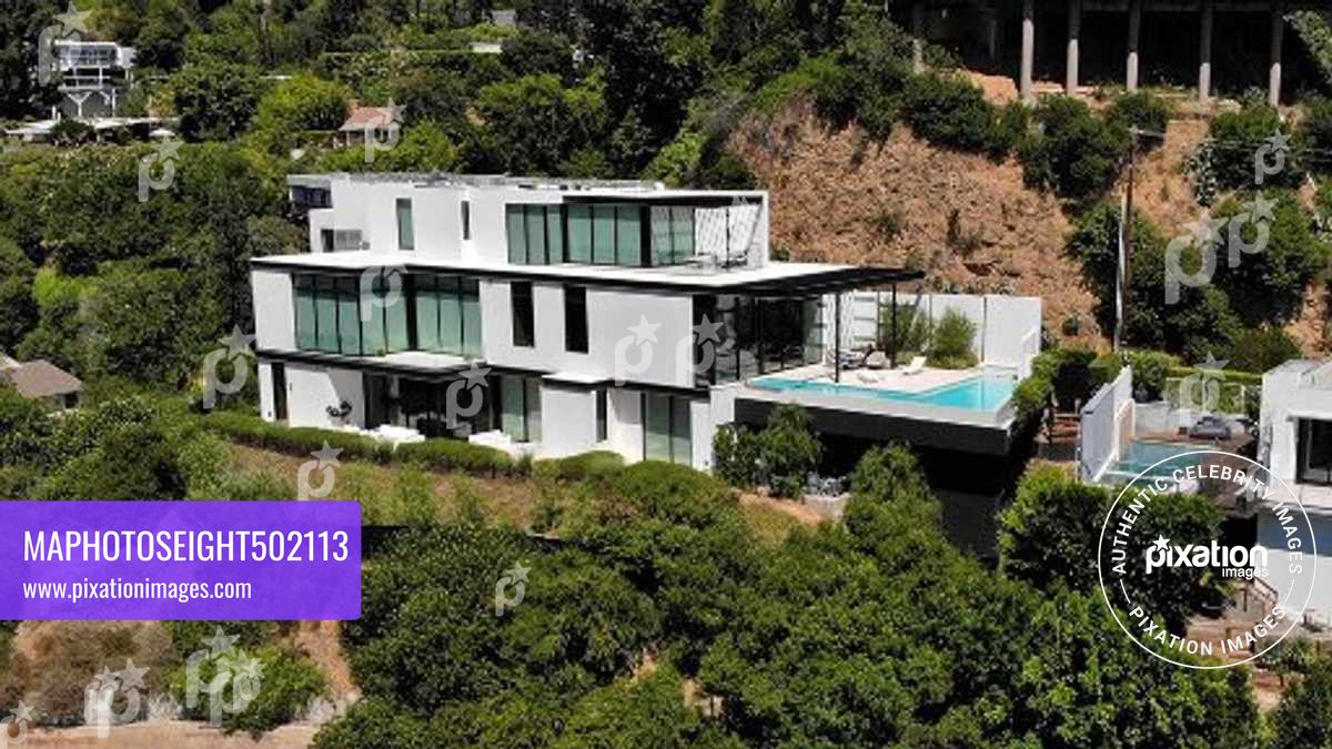 Ariana Grande purchases this $13.7 million Mega Mansion in the Hollywood Hills, The 10,000 square foot home has 4 bedrooms, 7 bathrooms, a wellness, 300 bottle wine cellar, a bar and a office