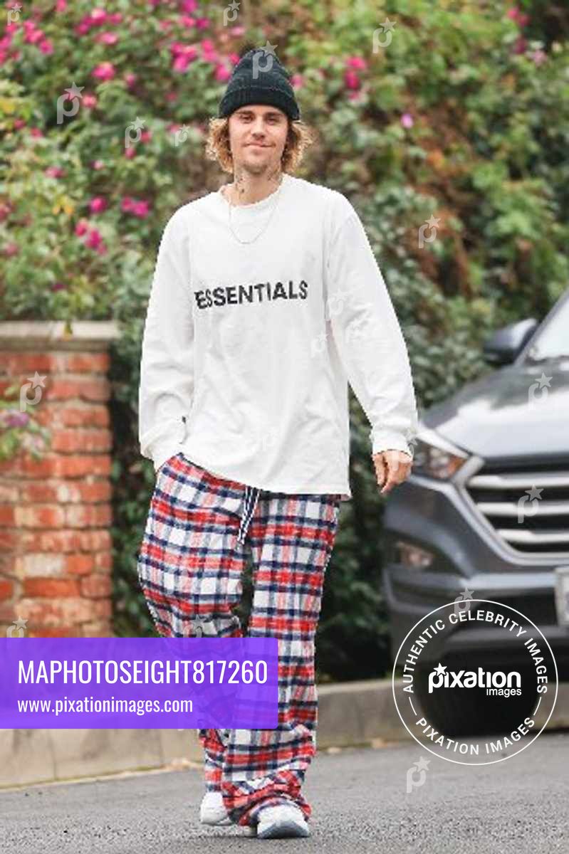 Justin Bieber smiles for the camera as he rocks a laid back outfit in LA.