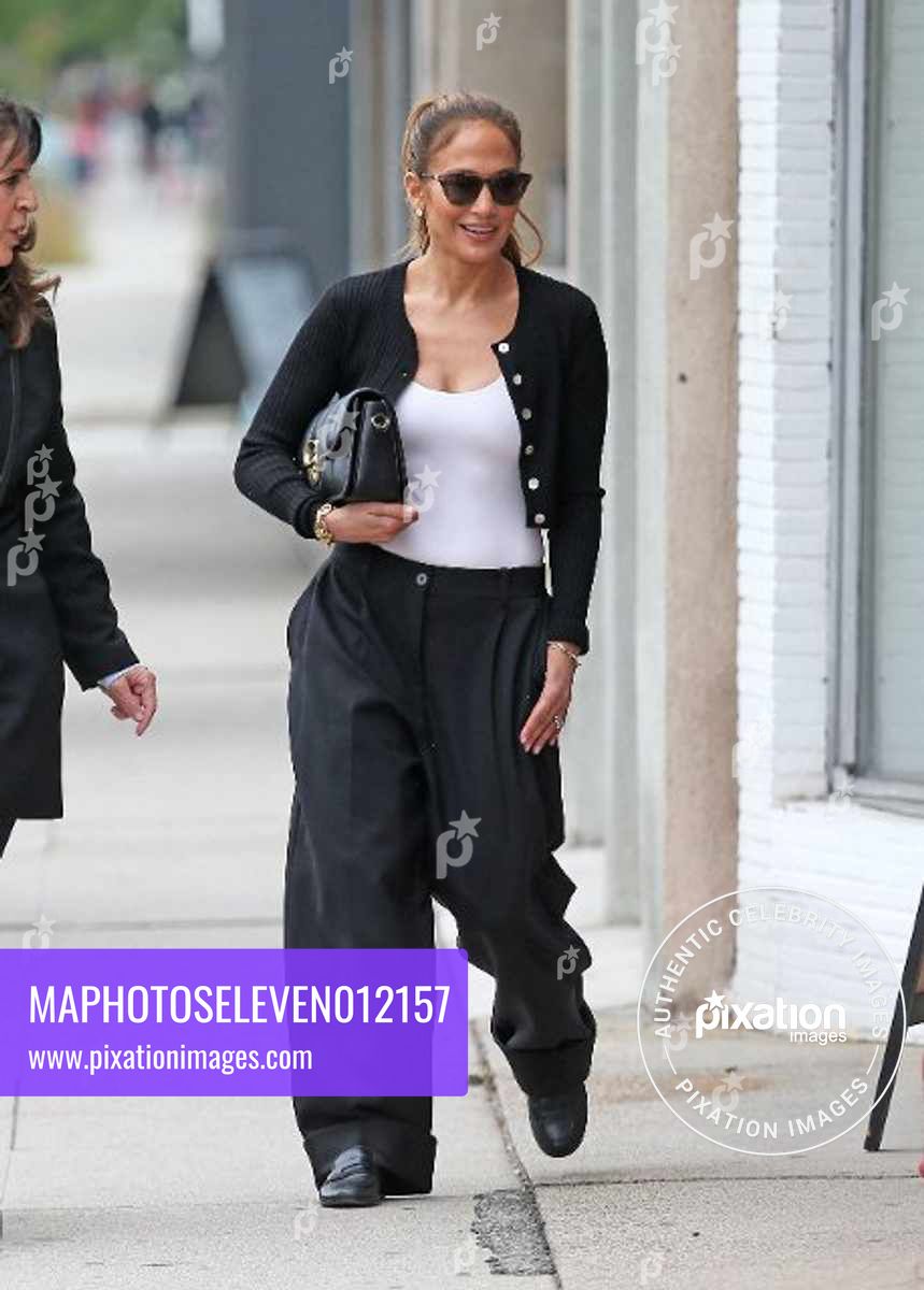 Jennifer Lopez is seen out window shopping with a friend