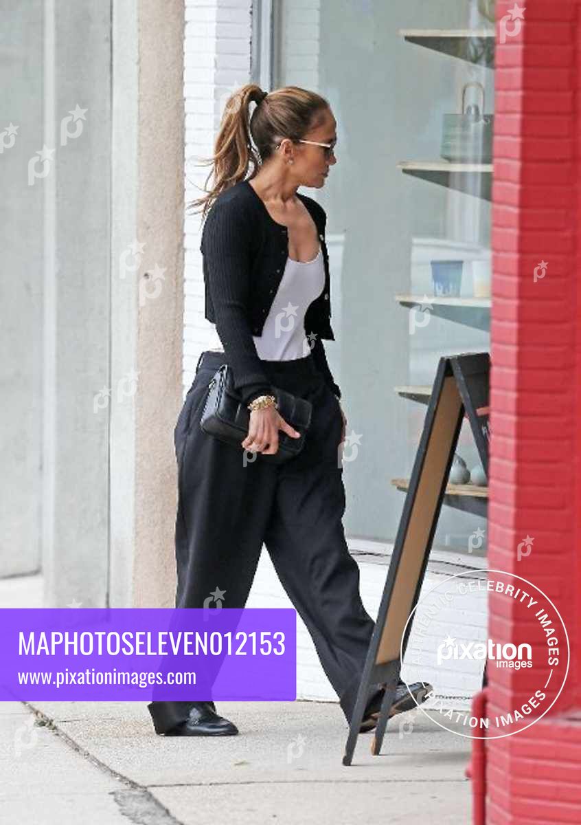 Jennifer Lopez is seen out window shopping with a friend