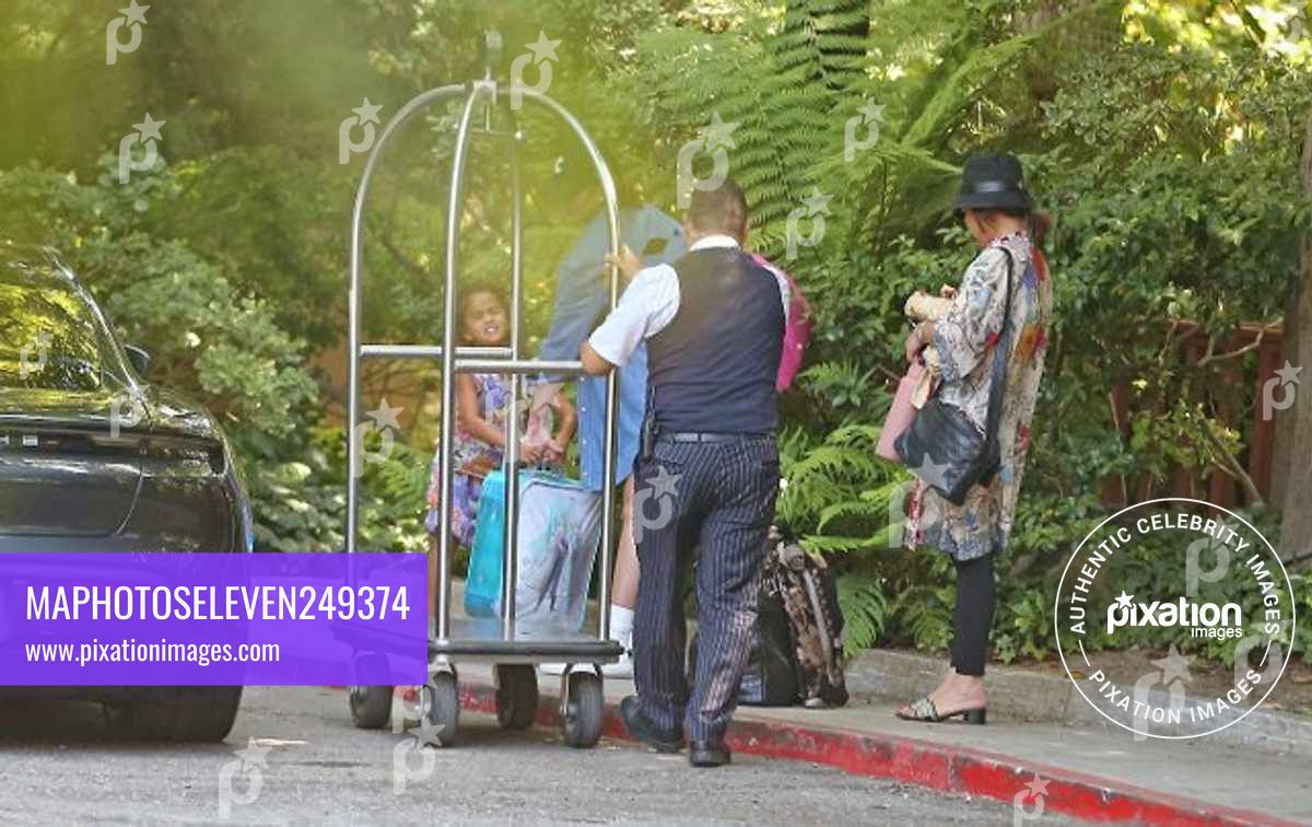 Chrissy Teigen and her daughter are seen arriving at the Belair hotel for a pool day