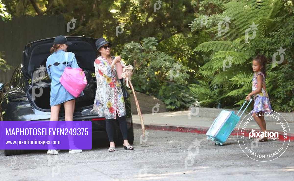 Chrissy Teigen and her daughter are seen arriving at the Belair hotel for a pool day