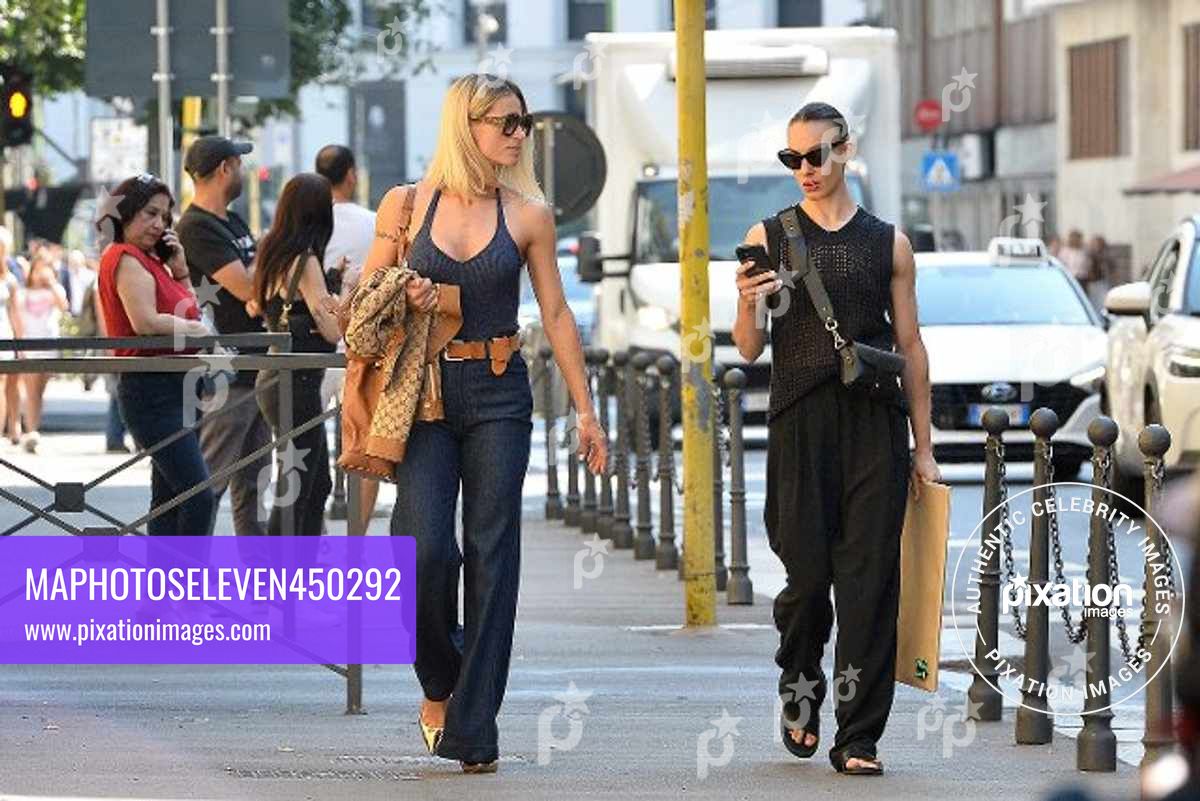 Michelle Hunziker seen in Milan with her friend Simona Quaranta and her manager, wearing a Gucci jacket and carrying a Gucci purse